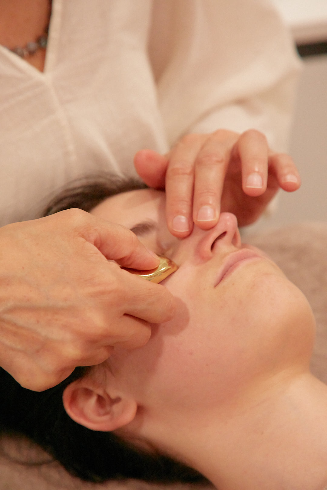 Client relaxing during the DOMA Ritual Lift treatment in London